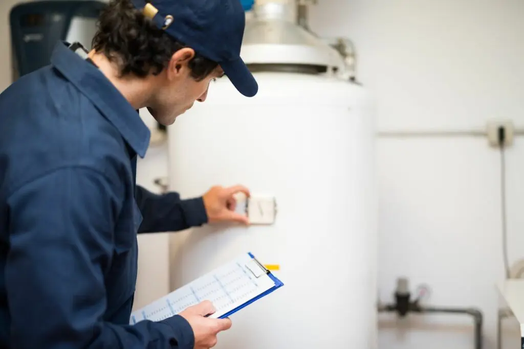 A Man Checking Controls and Writing on Note Pad